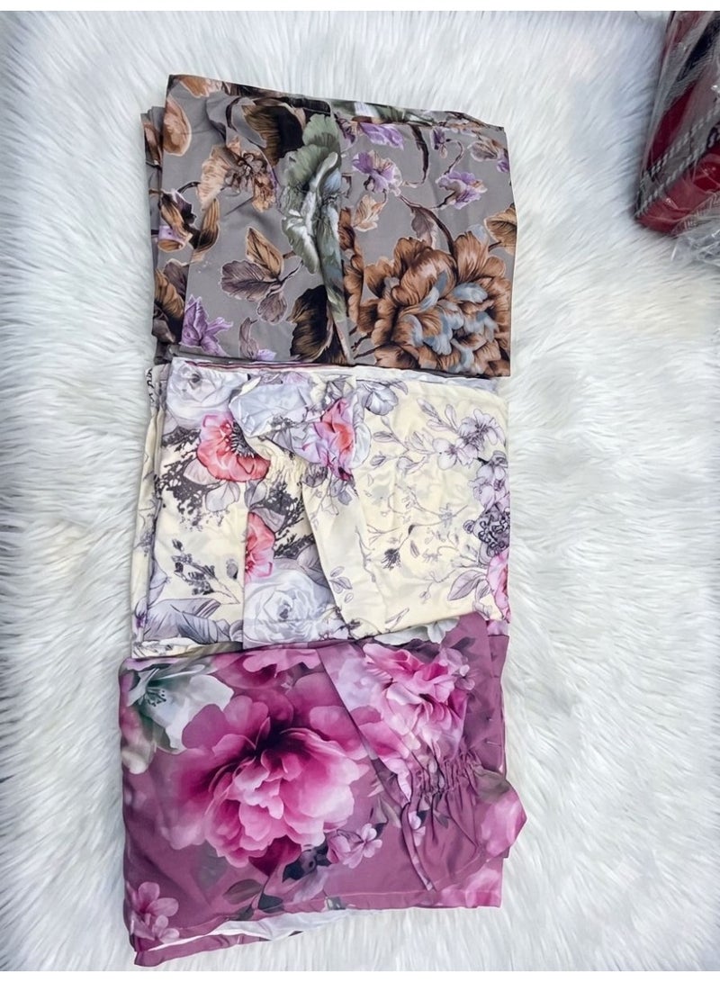 A set of digitally printed floral fabrics in various colors, suitable for tailoring jalabiyas and dresses.