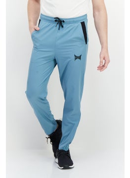 Men Regular Fit Brand Logo Sweatpants, Teal Blue - pzsku/Z5AA3A7280B621BF022A5Z/45/_/1726108881/a8447359-5e76-4ca3-9028-a7be4c8e4f76