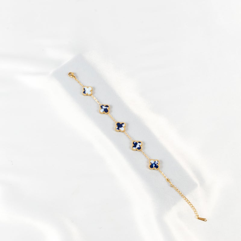 ذا بلاك بيرل اكسسوريز أنسيال أستانليس ستيل ذهبي مع شكل زهرة البرسيم بألوان خلابة - Image 1