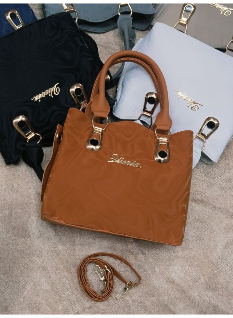 High-quality women's handbags, available in camel color. - Image 1