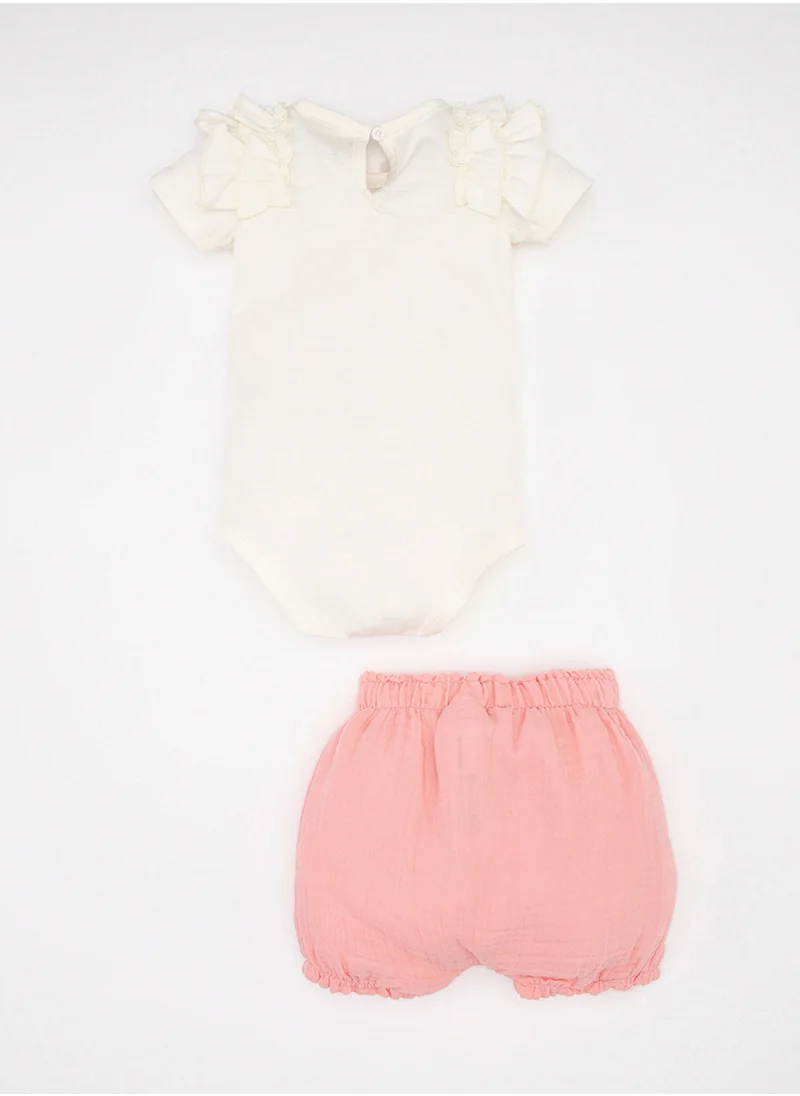 ديفاكتو Printed Short Sleeve Snap-Up Bodysuit Shorts Hat Muslin 3-Piece Set