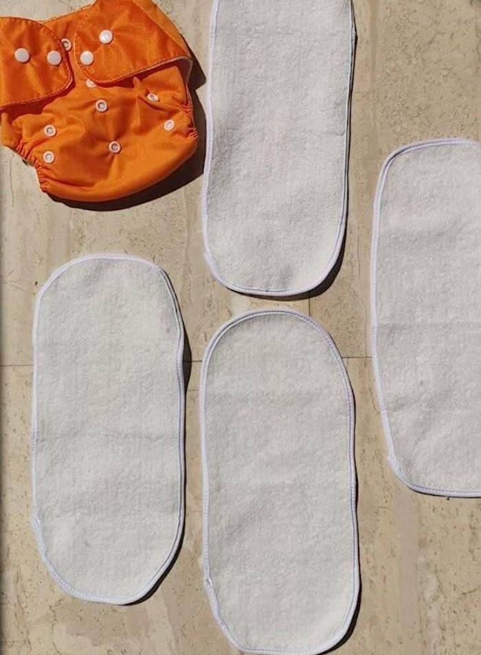 حفاض قماش للتدريب و السباحة قابل للتعديل و الغسل و قابل لاعادة الاستخدام - مقاس قابل للتعديل - مع قطعتين من القطن - (0 إلى سنتين و نصف) ( 3كيلو إلى 12كيلو) (برتقالي) - Image 2