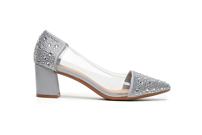 Embellished heeled pump with clear side panel