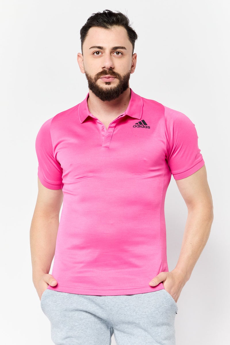 Adidas قميص بولو رياضي للرجال بأكمام قصيرة مناسب في الهواء الطلق، وردي - Image 1