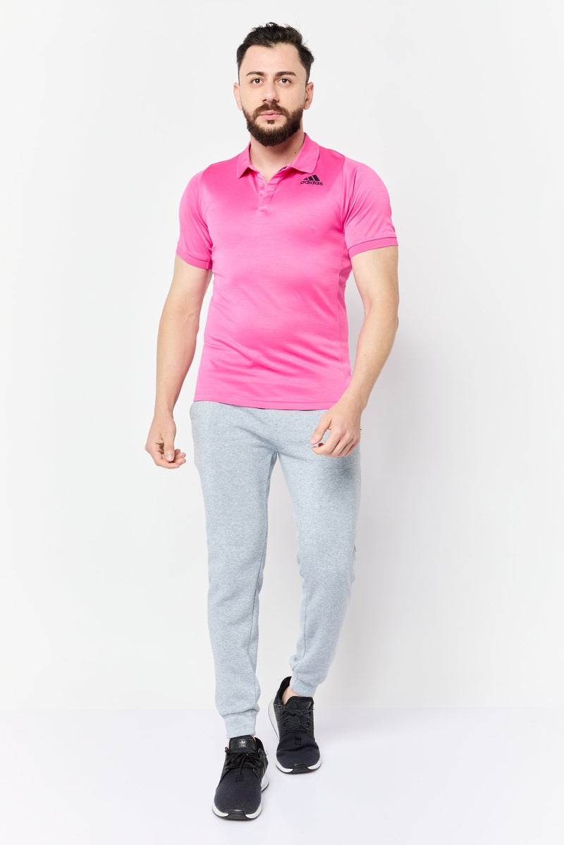 Adidas قميص بولو رياضي للرجال بأكمام قصيرة مناسب في الهواء الطلق، وردي - Image 3