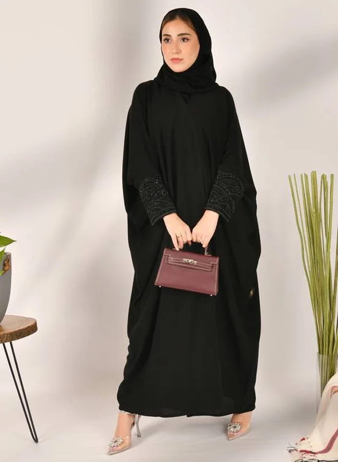 عبايات حوراء عباية لف سوداء  بتصميم بشت مزينة بشك اسود أنيق على الاكمام
