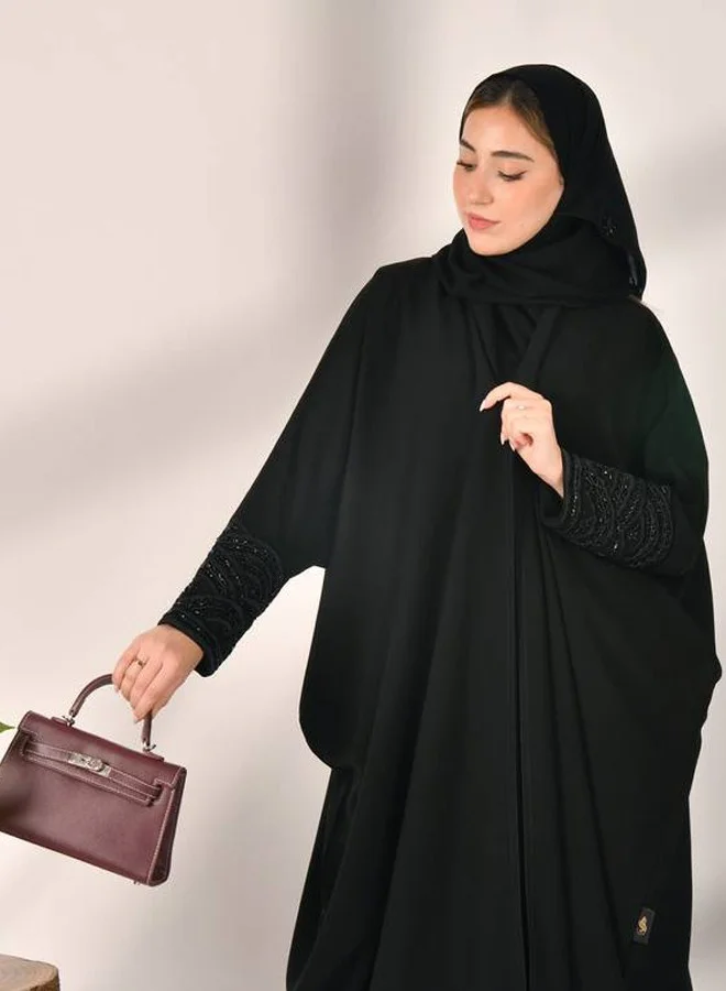 HAWRAA ABAYA Black wrap abaya with a bisht design, decorated with an elegant black check on the sleeves