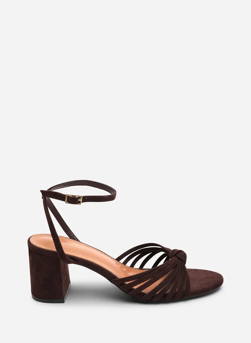 Where's That From Blossy Knotted Block Heel Sandal With Ankle Strap in Dark Brown Suede