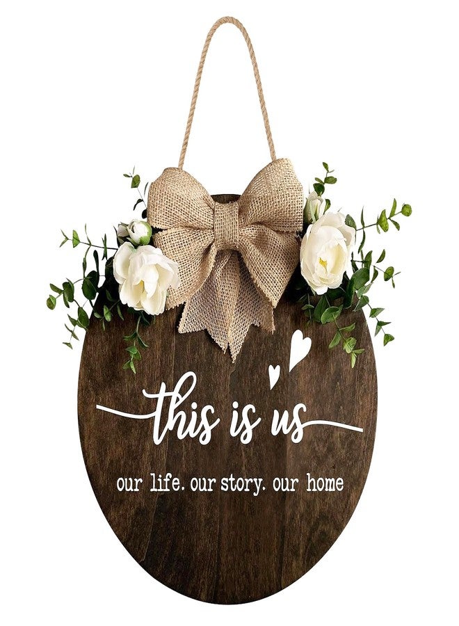 DOFAFALA This is Us" Welcome Sign, Farmhouse Round Wood Hanging Door Decor with Ribbon Bow and Artificial Greenery, Rustic Front Porch Wreath for Thanksgiving, Christmas, Brown Home Entry Decor - Image 1