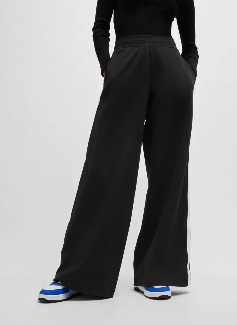 هوجو Wide-leg stretch-cotton tracksuit bottoms with logo tape