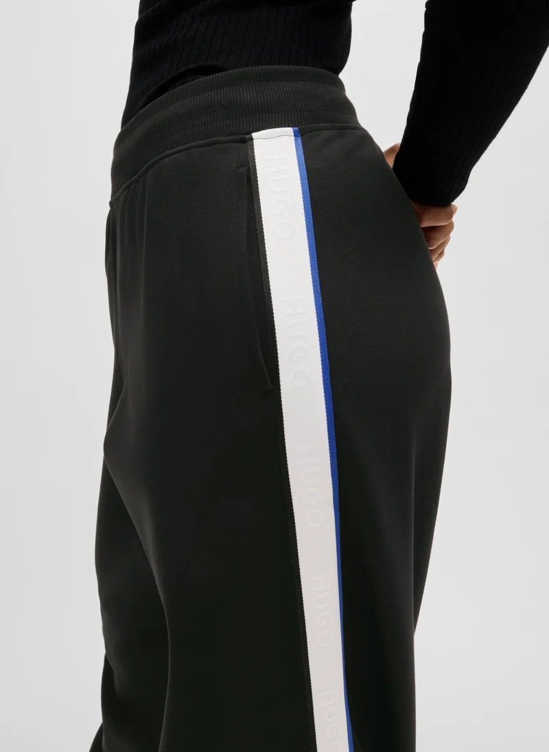 هوجو Wide-leg stretch-cotton tracksuit bottoms with logo tape