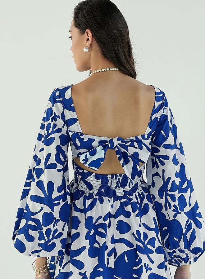 SASSAFRAS All Over Print Back Tie Knotted Flare Mini Dress by Styli