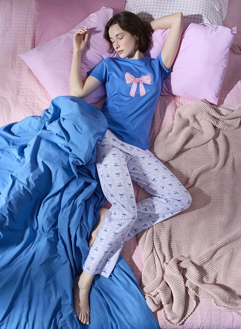 بنتي طقم بيجاما أزرق بفيونكات أنيقة