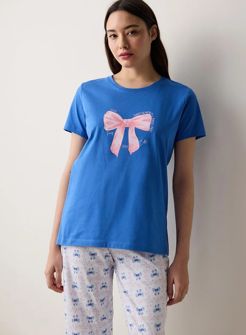 بنتي طقم بيجاما أزرق بفيونكات أنيقة