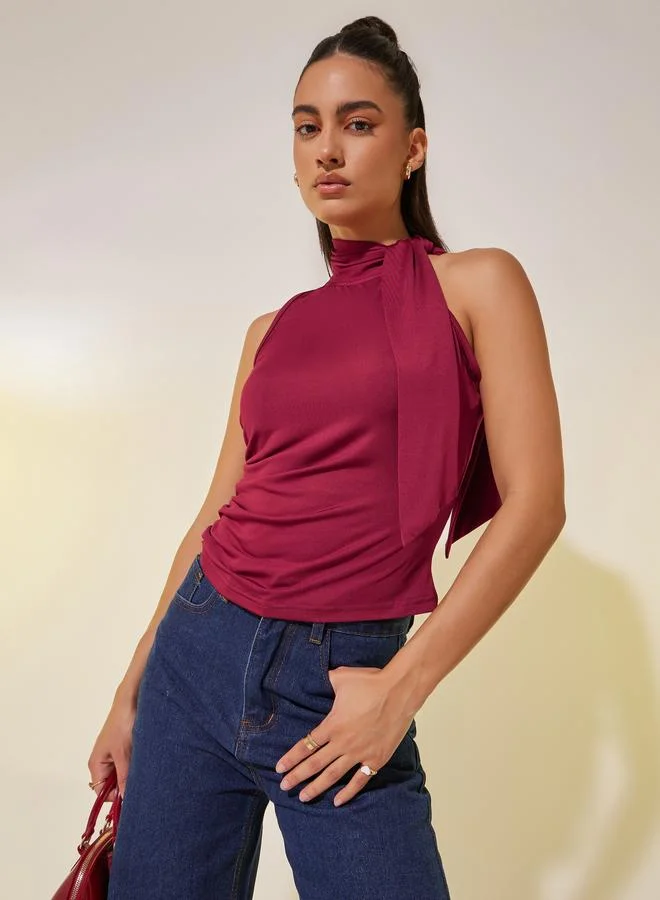 تايك تو توب محبوك بدون أكمام بياقة عالية بلون سادة