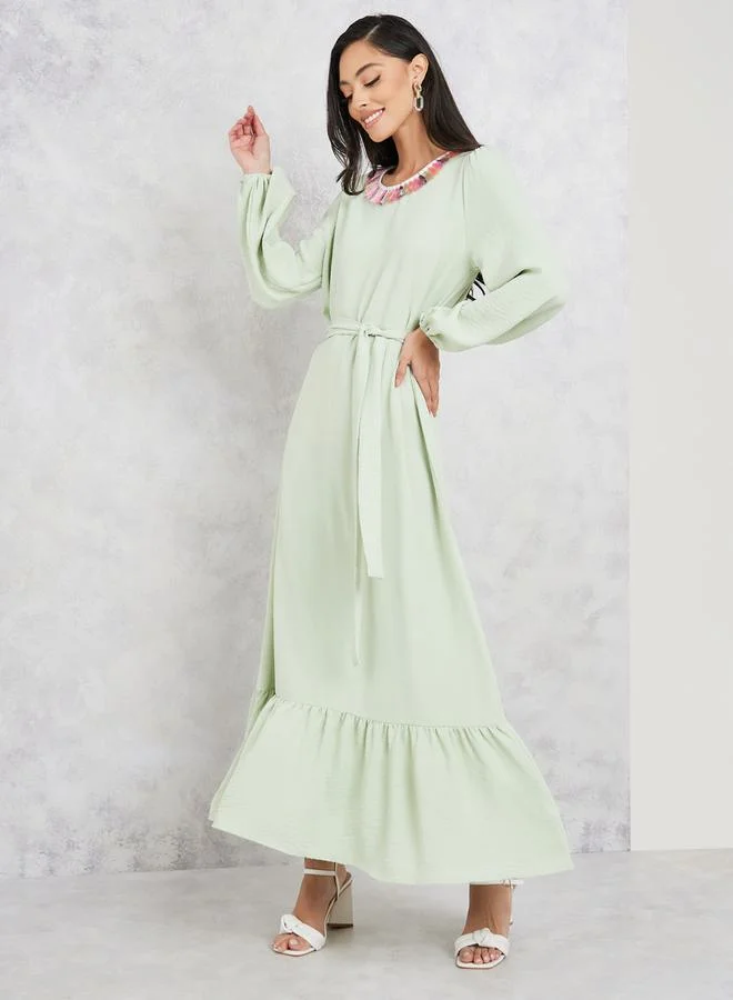ستايلي Tassel Trim Round Neck Tiered Maxi Dress with Tie Up Belt