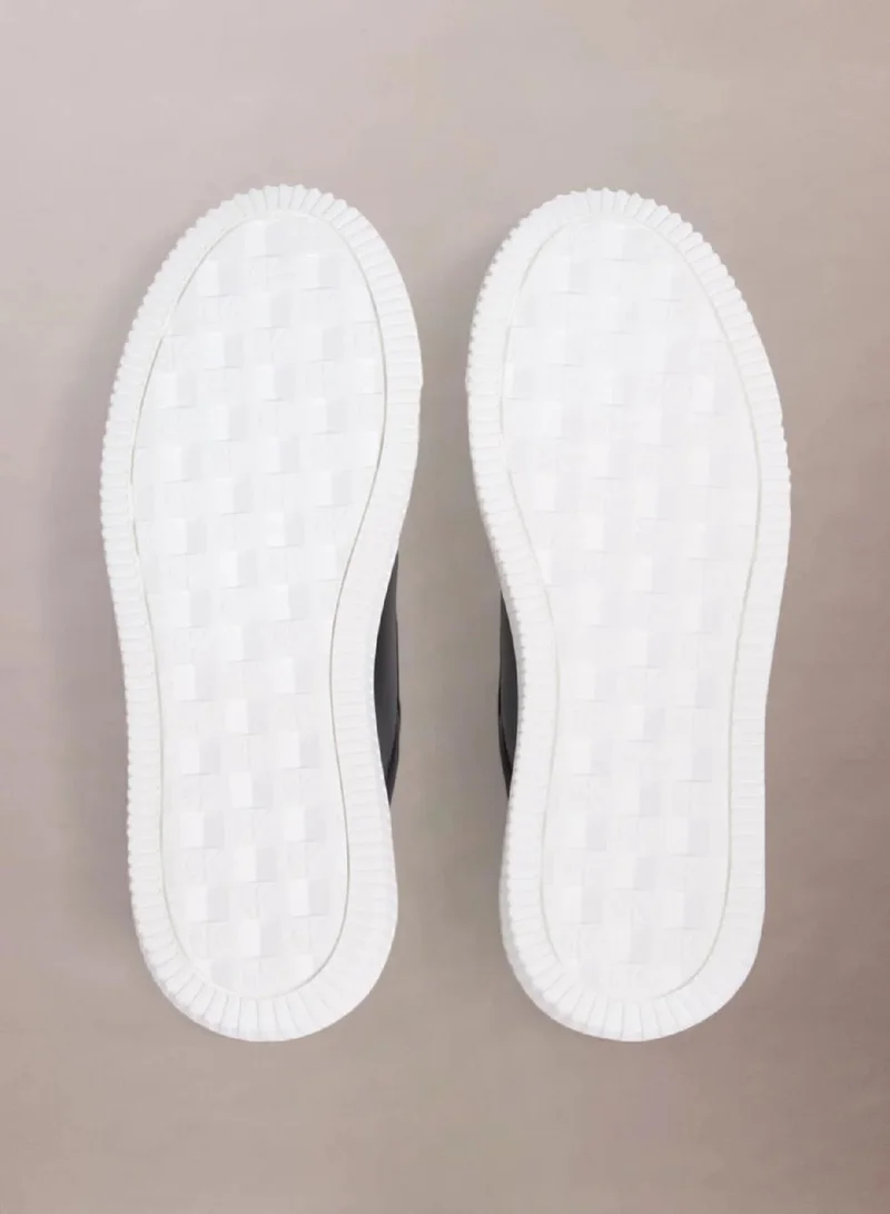 Calvin Klein Black/Bright White Leather Trainers for Women | Best Price UAE