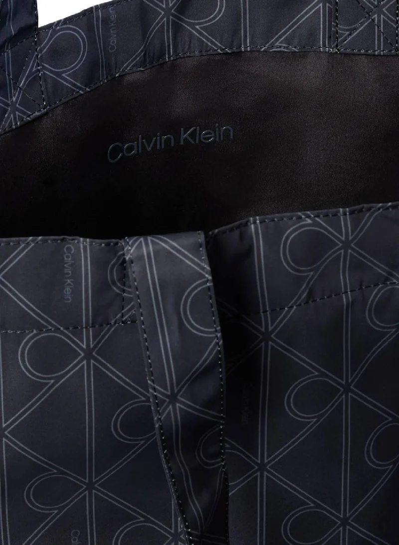 Calvin Klein Jeans Pirate Black Printed Monogram Tote Bag for Men | Best Price UAE