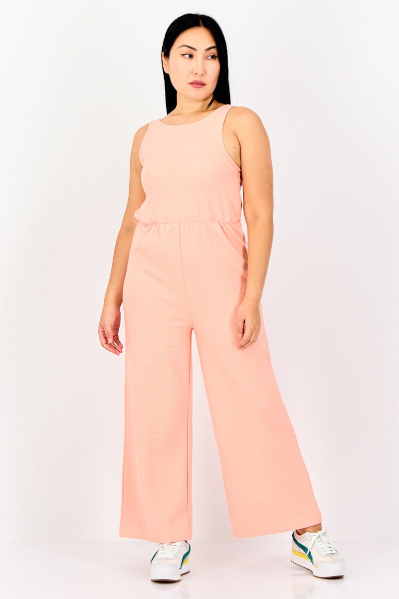 PUMA Women Sportswear Fit Sleeveless Outdoor Jumpsuit, Pink - Image 1