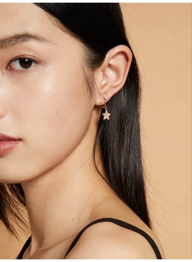 Luxuria Gold-tone hoop earrings with a dangling star coated in white enamel. - Image 3