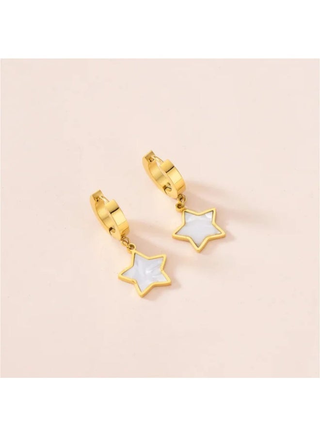 Luxuria Gold-tone hoop earrings with a dangling star coated in white enamel. - Image 4