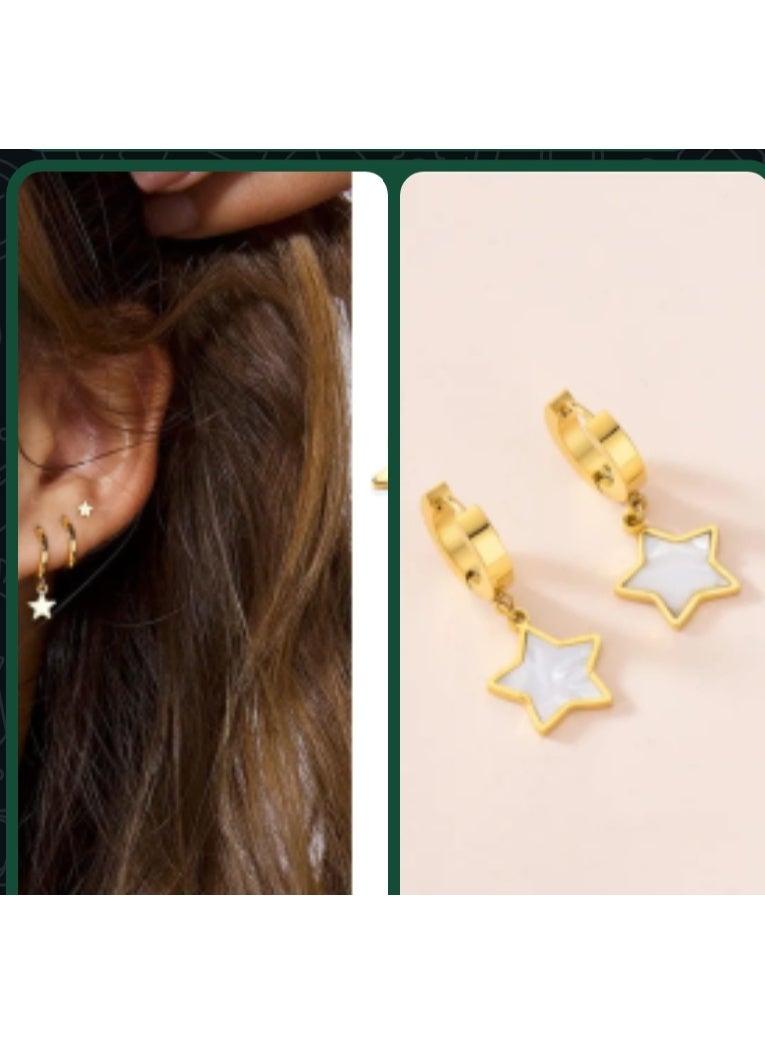 Luxuria Gold-tone hoop earrings with a dangling star coated in white enamel. - Image 5