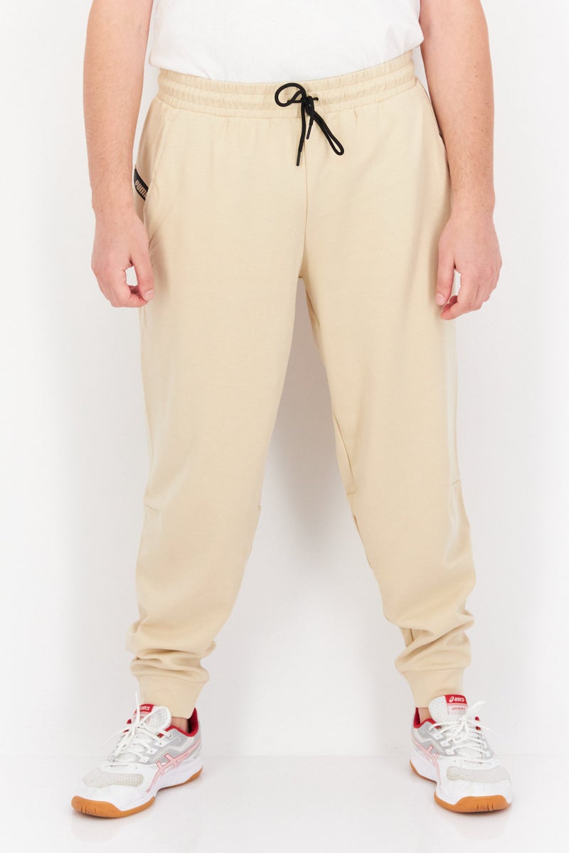 PUMA Men Sportswear Fit Training Pants, Beige - Image 1
