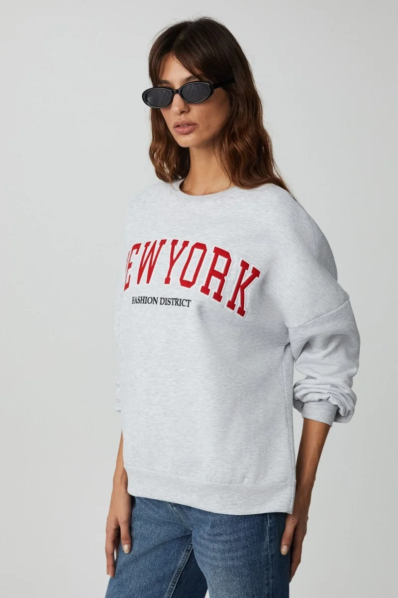 GRIMELANGE Jordan Women's Long Sleeve Round Neck Front Applique Embroidered Off Shoulder Oversize Sweatshirt