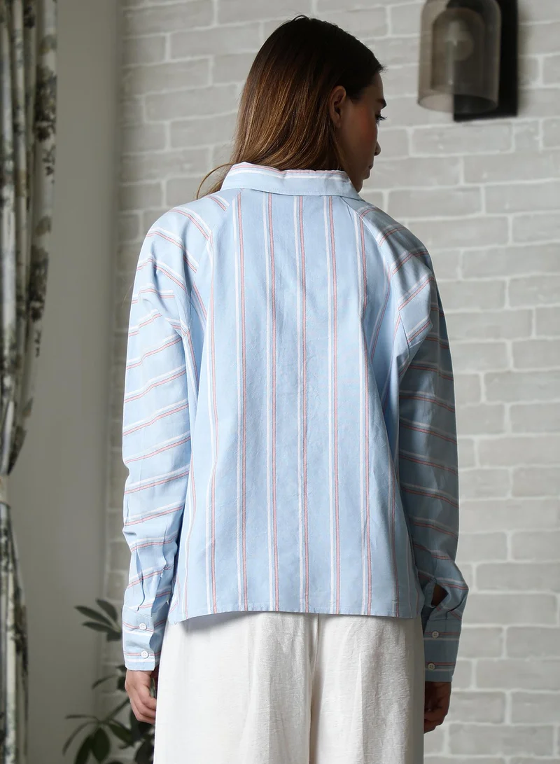 Campus Sutra Women's Baby Blue Striped Oversized Shirt For Casual Wear | Spread Collar | Long Cuffed Sleeves | Button Closure | Oversized Shirt Crafted With Comfort Fit For Everyday Wear