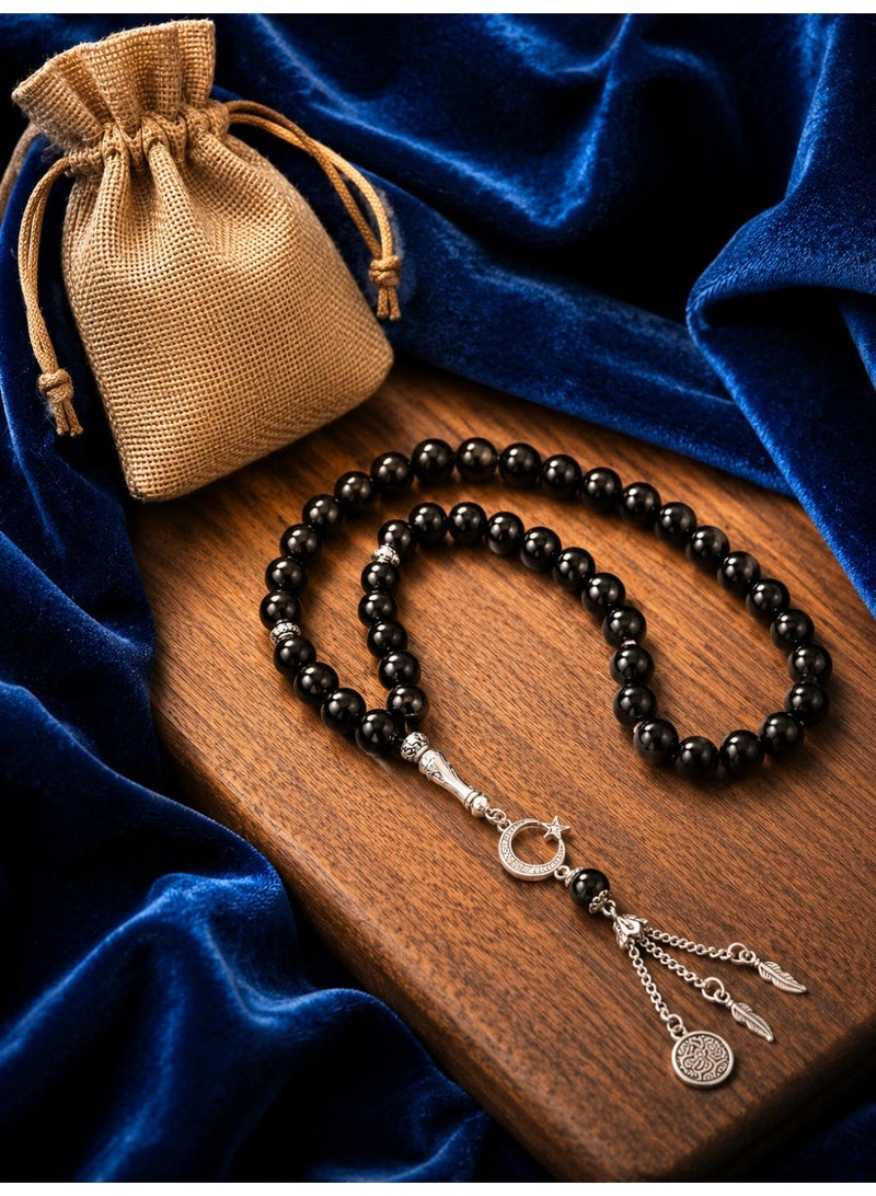 سبحة 33 حبة من الزجاج البركاني ألاسود مقاس 10 مم  مع كيس خيش - Image 1