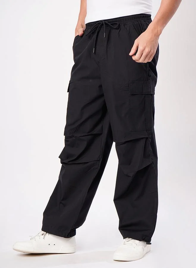 ستايلي Men Black Parachute Fit Cargo Trousers By Bene Kleed