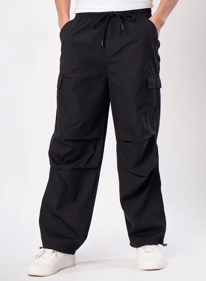 ستايلي Men Black Parachute Fit Cargo Trousers By Bene Kleed