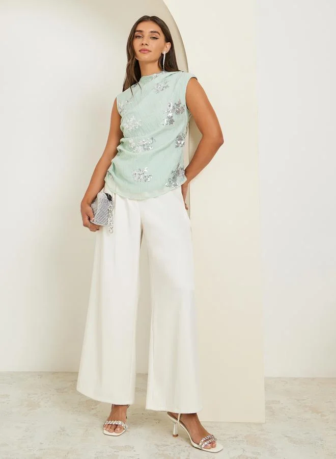 ستايلي بلوزة بلا أكمام مزينة بالترتر