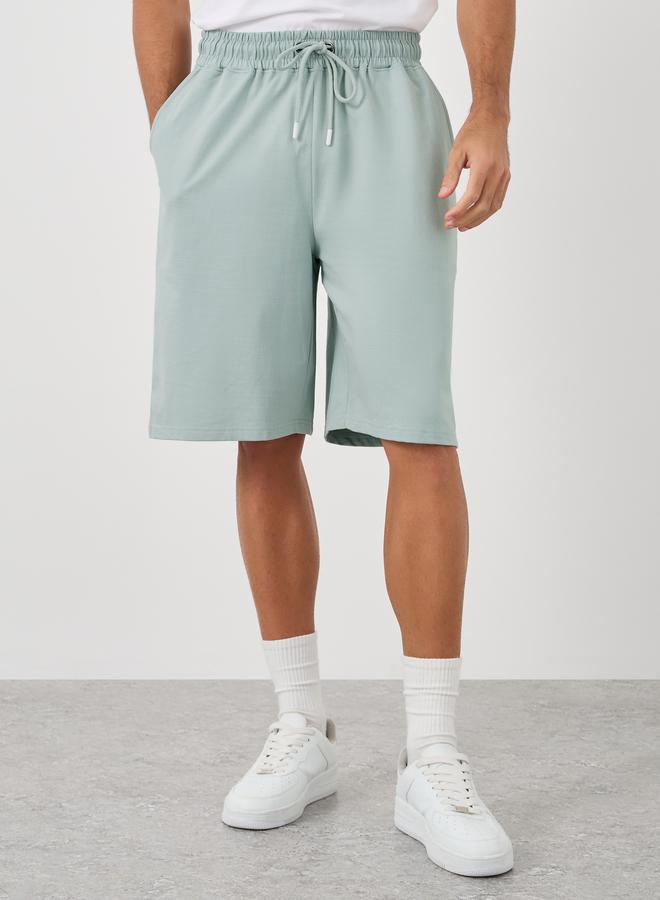 Styli Solid Oversized Shorts with Drawstring - Image 1