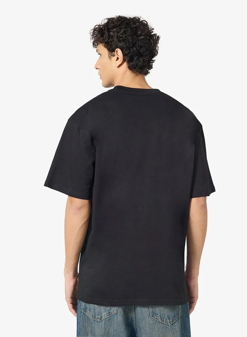 كارل كاني تيشيرت تراثي واسع مقاس