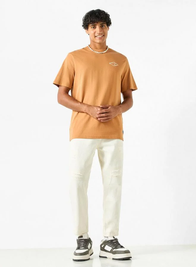 لي كوبر تيشيرت بياقة ضيّقة وأكمام قصيرة بطبعات شعار من لي كوبر