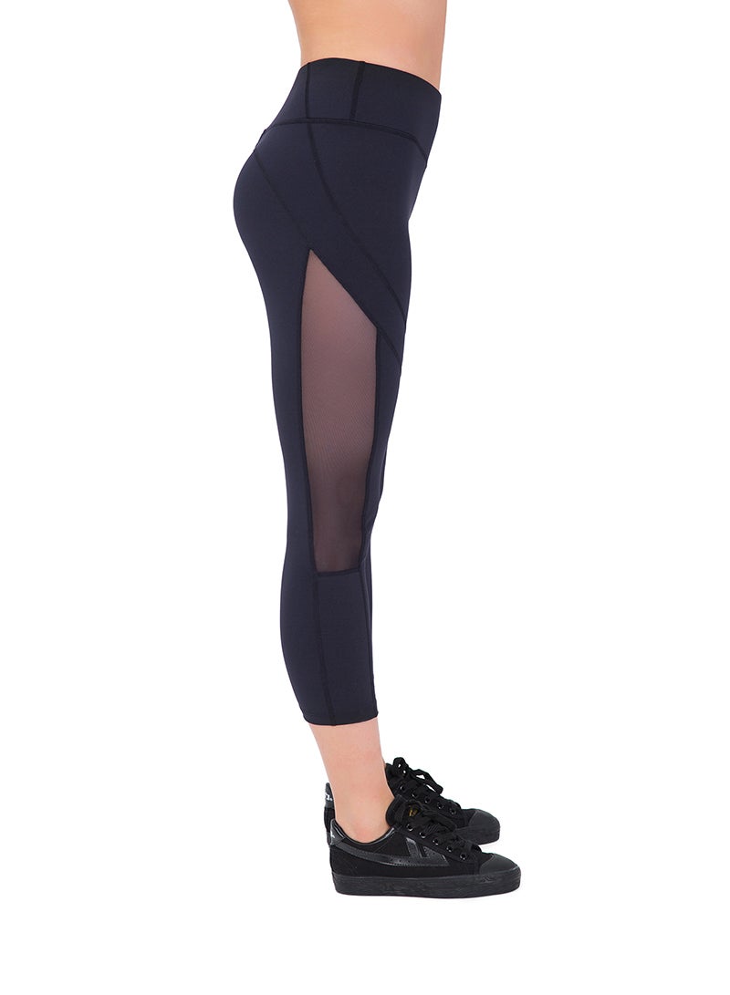 Sharpdo Women's Mid Waist Side Mesh Dry Fit Workout Capri Leggings with Inner Pocket - Image 1