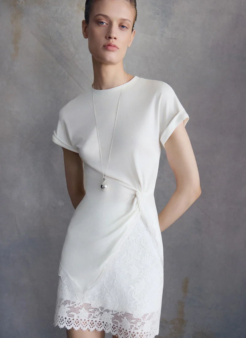 Lichi Long-line T-shirt with draping and lace trim along the hem