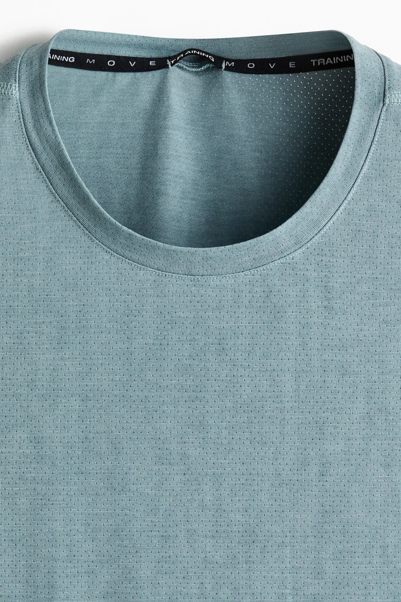 اتش اند ام بلوزة فيست رياضية بقصة عادية من نسيج دراي موف