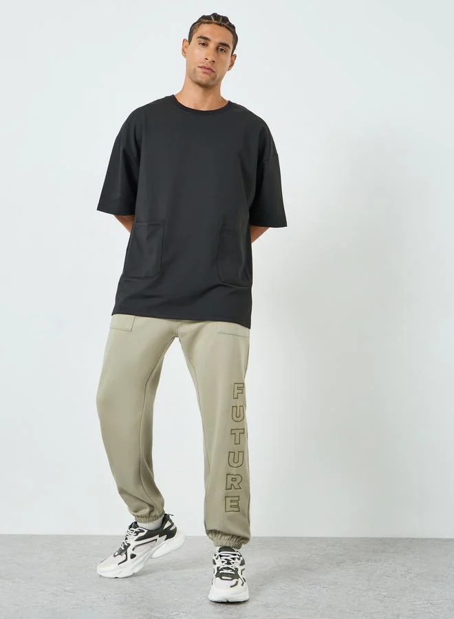Styli Men Relaxed Fleece Embroidered Joggers