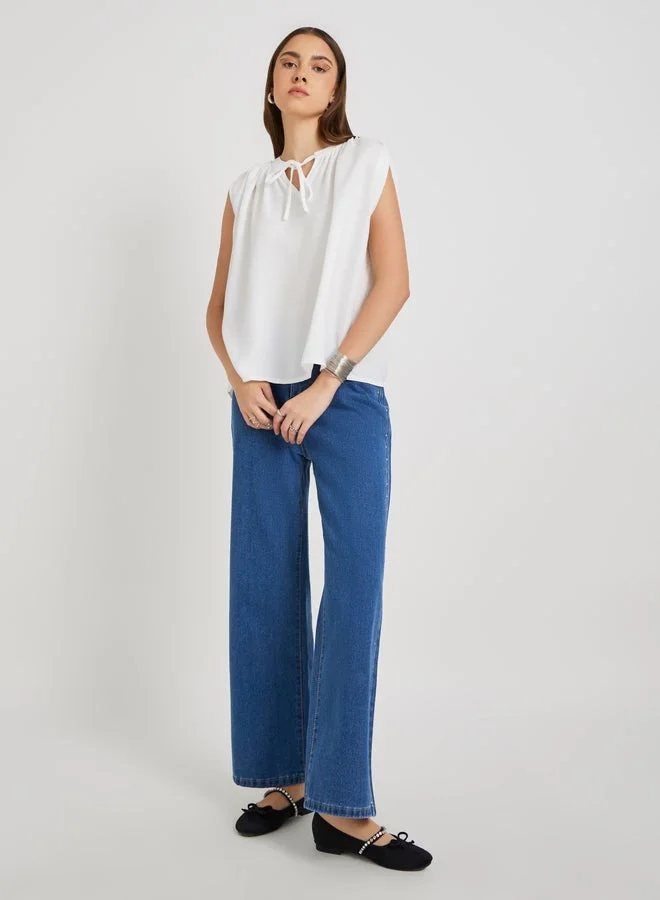 Take Two Solid Sleeveless Tie-Up Neck Blouse