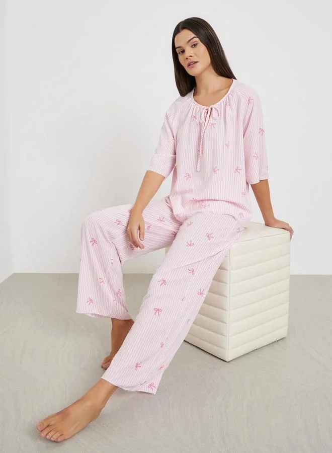 Styli All-Over Stripe and Bow Print Tie-Up Neck Top and Pyjama Set