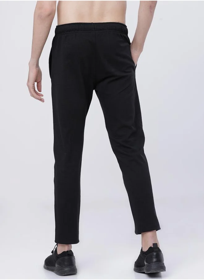 HIGHLANDER Slogan Print Slim Fit Track Pants by Styli
