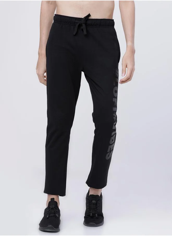 HIGHLANDER Slogan Print Slim Fit Track Pants by Styli