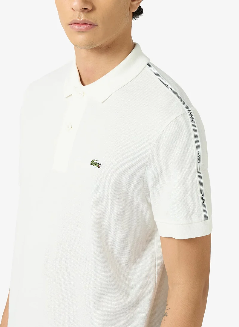 LACOSTE  Regular Fit Striped Band Piqué Polo for Men | Best Price UAE