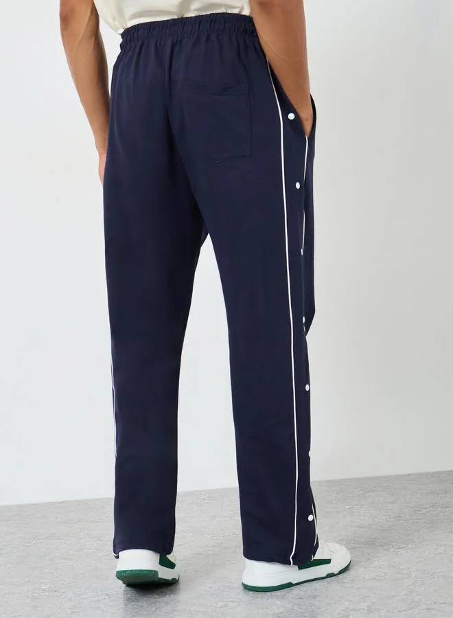 Styli  Contrast Piping and Popper Oversized Open Hem Joggers for Men | Best Price UAE