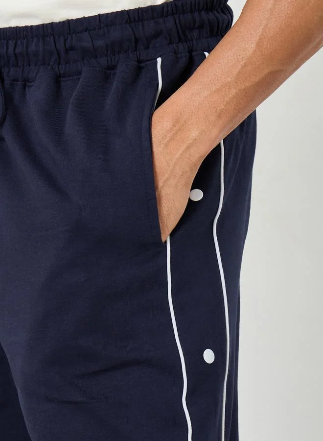 Styli  Contrast Piping and Popper Oversized Open Hem Joggers for Men | Best Price UAE