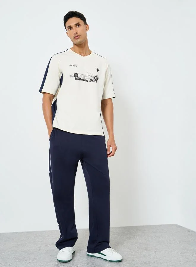 Styli  Contrast Piping and Popper Oversized Open Hem Joggers for Men | Best Price UAE