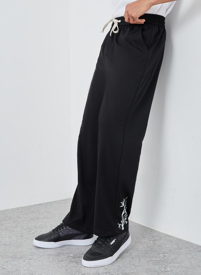 Styli Woven Relaxed Fit Joggers with Graphic Print - Image 1