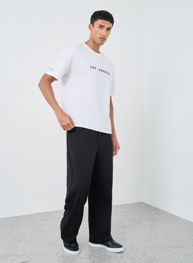 Styli Woven Relaxed Fit Joggers with Graphic Print - Image 2